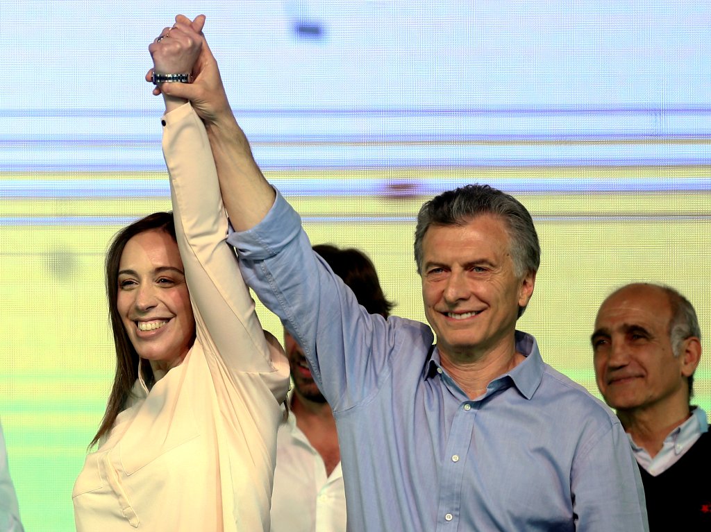 Argentina's President Mauricio Macri and Buenos Aires' governor Maria Eugenia Vidal hold hands as they celebrate at their campaign headquarters in Buenos Aires, Argentina October 22, 2017. REUTERS/Marcos Brindicci