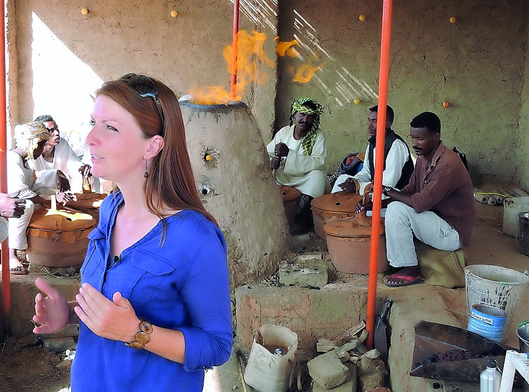 Dr Jane Humphris with workers at the UCL Qatar Iron and Kush Information Point.