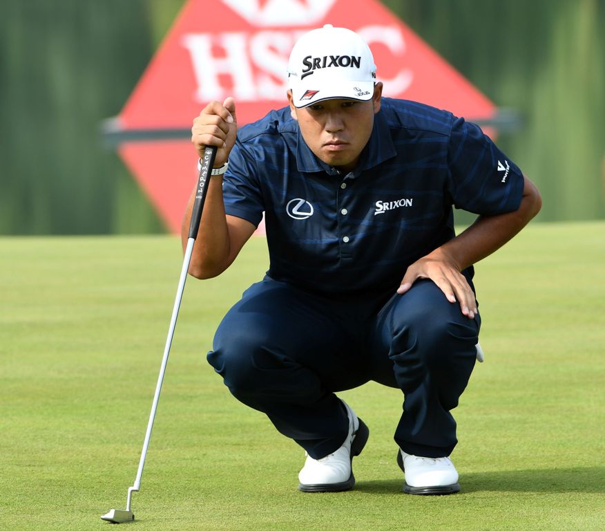 Hideki Matsuyama of Japan lines up a putt during the first round at the WGC-HSBC Champions at the Sheshan International golf club in Shanghai on October 26, 2017. / AFP / GOH CHAI HIN