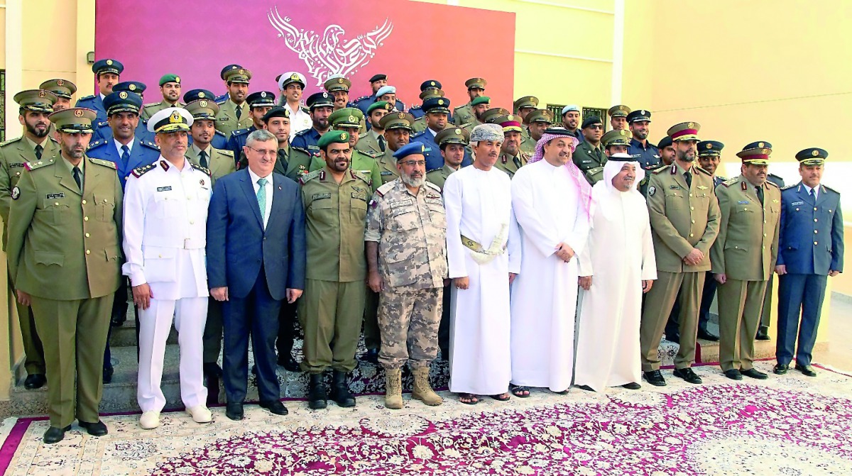 Minister of State for Defence Affairs H E Dr Khalid bin Mohammed Al Attiyah, Chief of Staff of the Qatari Armed Forces Major General (Pilot) H E Ghanem bin Shaheen Al Ghanem, and other senior officials and faculty members with the graduates.