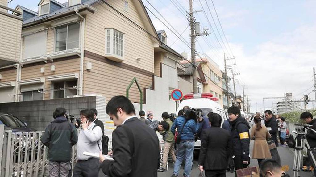 Members of the media gather in front of an apartment building where media reported nine bodies were found in Zama, Kanagawa Prefecture, Japan in this photo taken by Kyodo on October 31, 2017.(Photo: Kyodo/via Reuters).