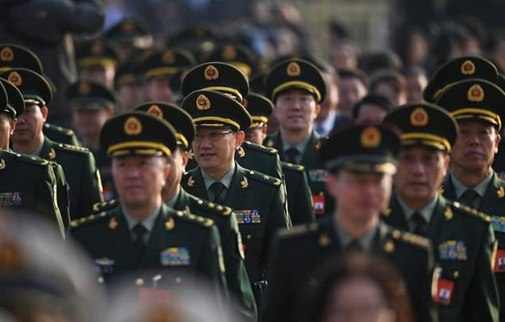 China's military, the world's largest, is technically the armed force of the ruling Communist Party rather than the state. / AFP.