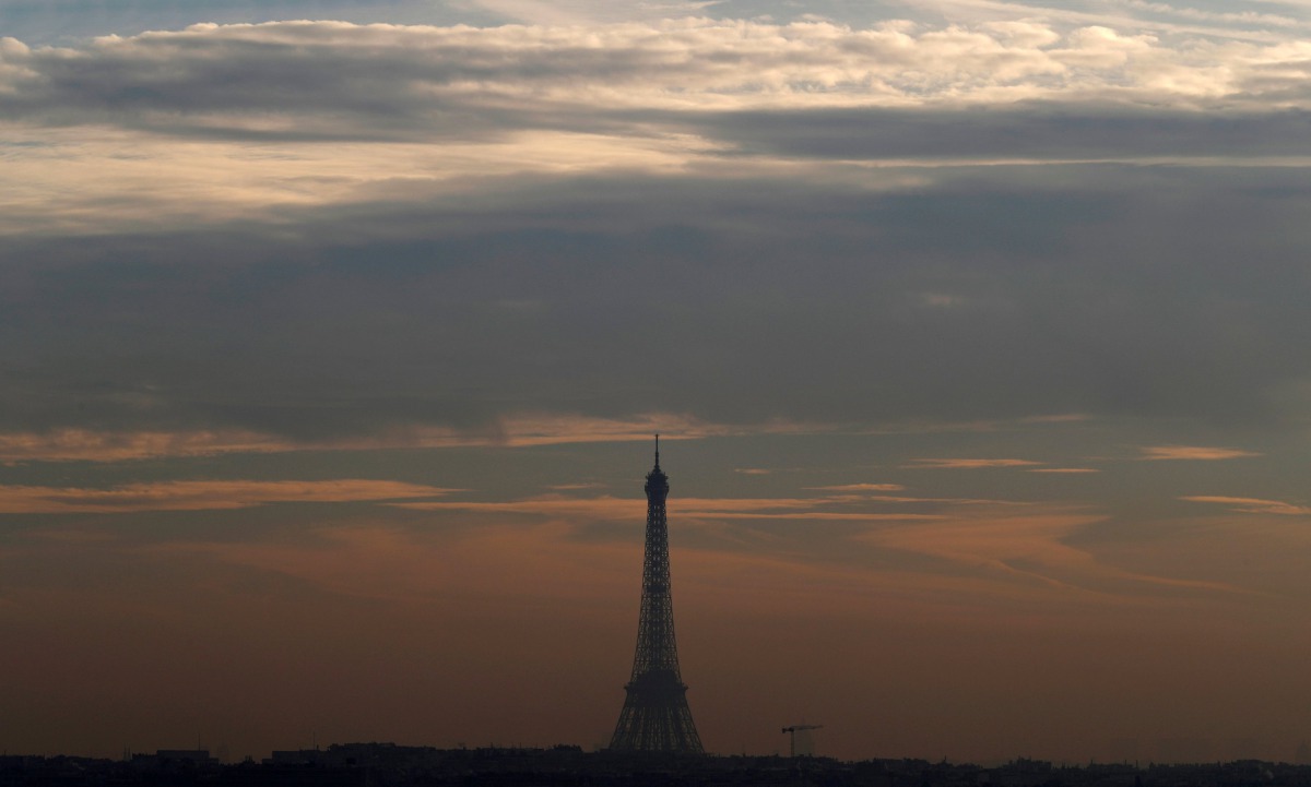 A small-particle haze hangs above the Eiffel Tower that is seen on the horizon from Suresnes near Paris, France, December 8, 2016