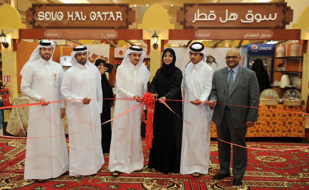 Ibthihaj Al Ahmedani (third right), Board Member of Qatar Chamber, cutting a ribbon with Sheikh Khalifa bin Khaled bin Hamad Al Thani (third left), Vice-Chairman of Hyatt Plaza Mall, and other guests on the opening of Souq Hal Qatar at Hyatt Plaza yesterd