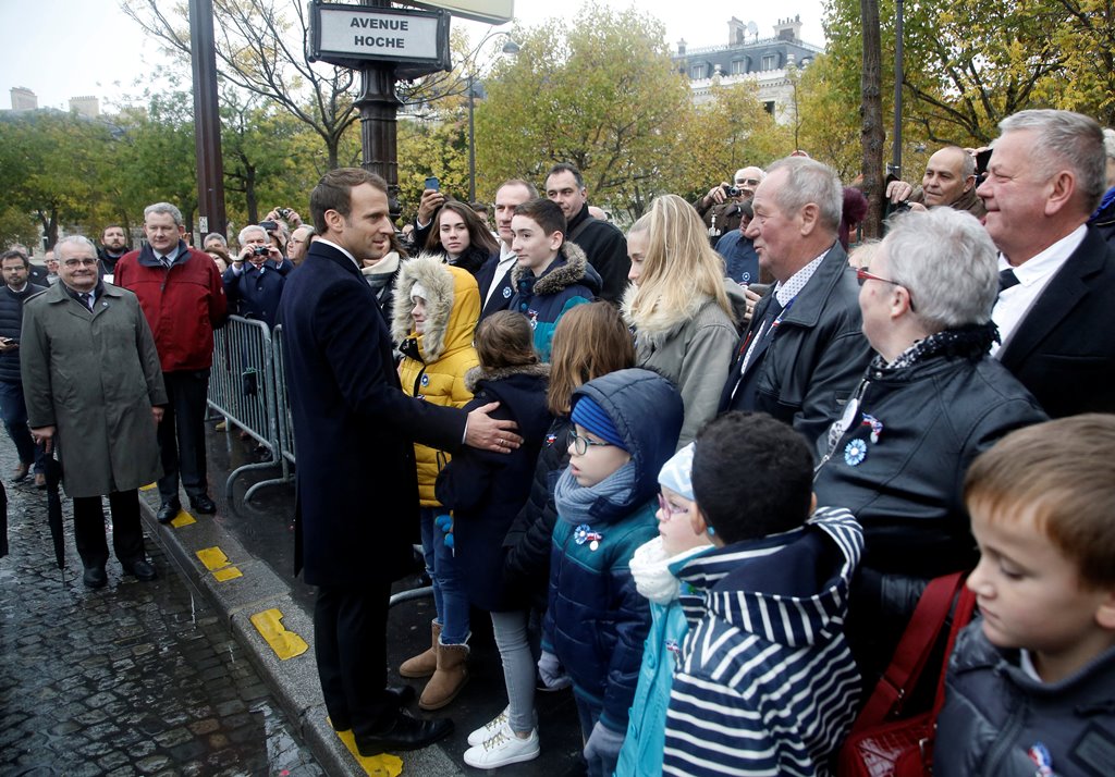 French President Emmanuel Macron shakes hand with people during Armistice Day ceremonies marking the end of World War I, in Paris, France, November 11, 2017. REUTERS/Thibault Camus/Pool
