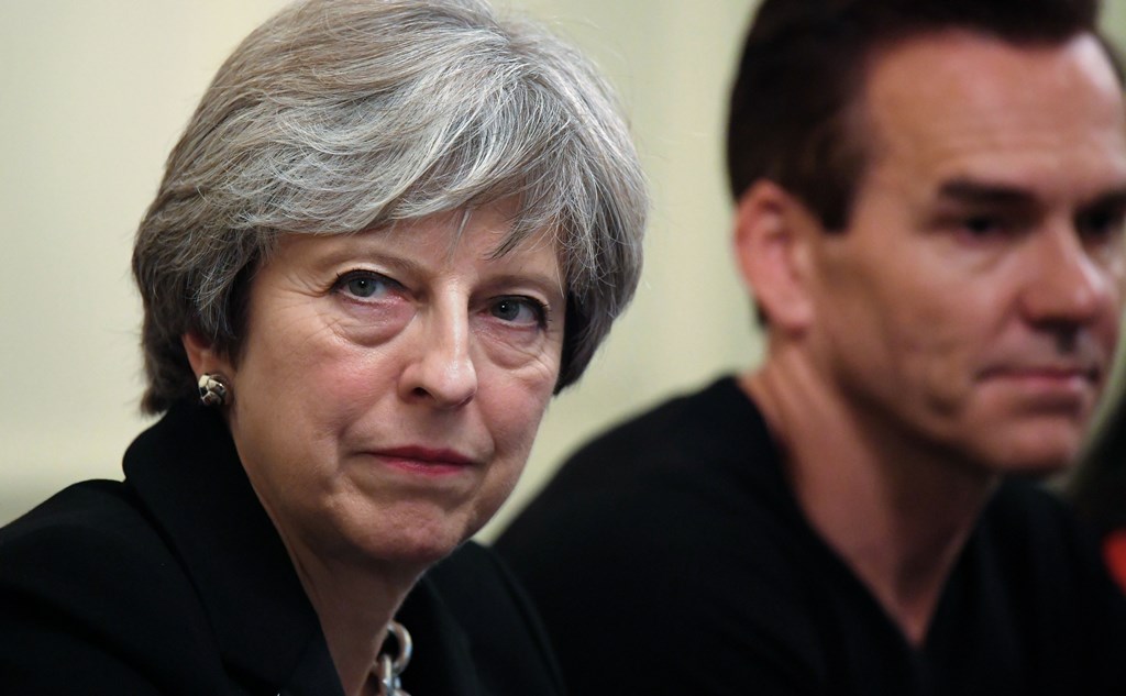 Britain's Prime Minister Theresa May gestures during an industry roundtable with leading figures from the tech sector hosted by herself and Britain's Chancellor of the Exchequer Philip Hammond at 10 Downing Street, London on November 15, 2017. / AFP / POO