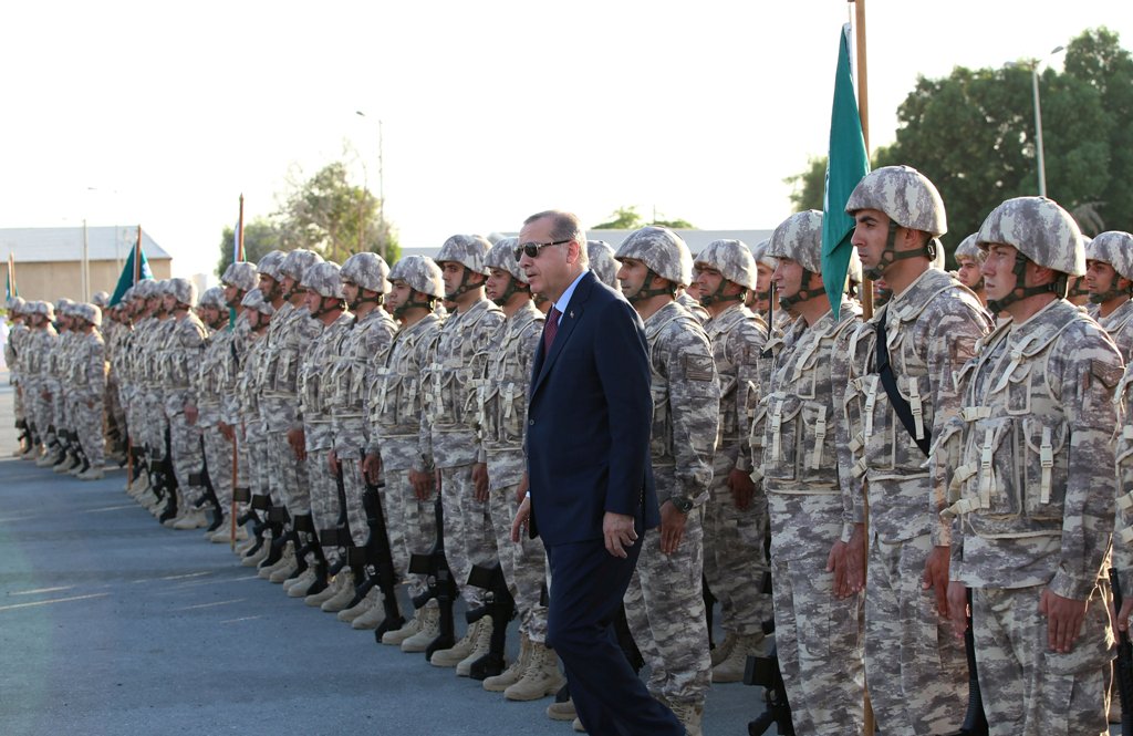 Turkey's President Tayyip Erdogan reviews Turkish troops during his visit at the Qatari-Turkish Armed Forces Land Command Base in Doha, Qatar, November 15, 2017. Yasin Bulbul/Presidential Palace 
