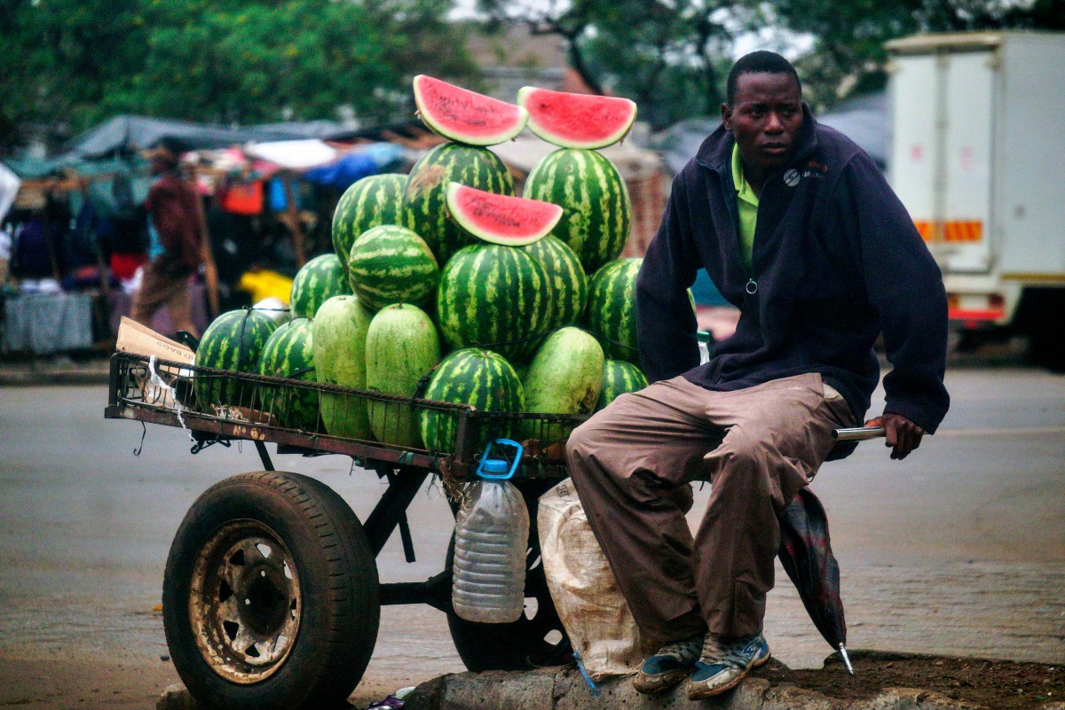 A vendor sells watermelons at a marketplace in the Mbare suburb of Harare on November 16, 2017, a day after the military took power and announced plans to arrest 