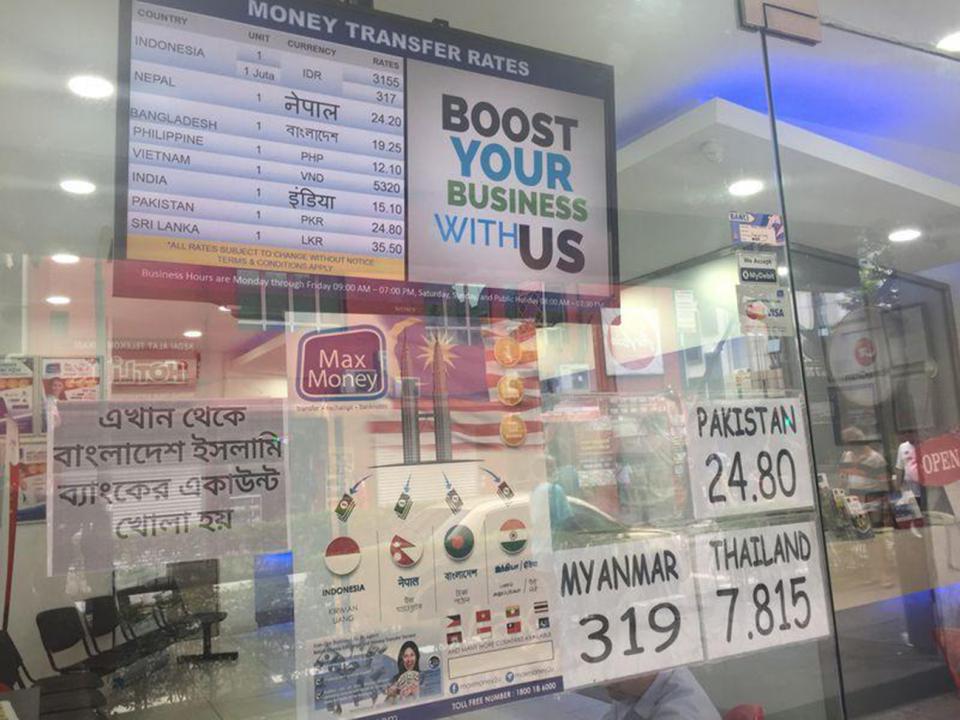 A sign outside a licensed money transfer company in Kuala Lumpur, Malaysia on November 2, 2017. Thomson Reuters Foundation/ Beh Lih Yi