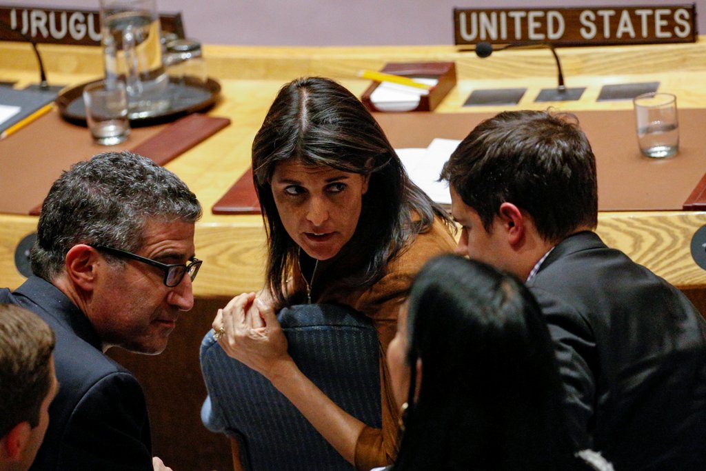 U.S. Ambassador to the United Nations Nikki Haley speaks with a member of her team following a U.N. Security Council meeting on a bid to renew an international inquiry into chemical weapons attacks in Syria, at the United Nations headquarters in New York,