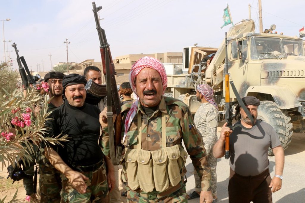 Iraqi pro-government forces gather in Rawa on November 18, 2017, after troops retook the Euphrates valley town from Islamic State group jihadists. Suleiman al-Anbari, AFP.