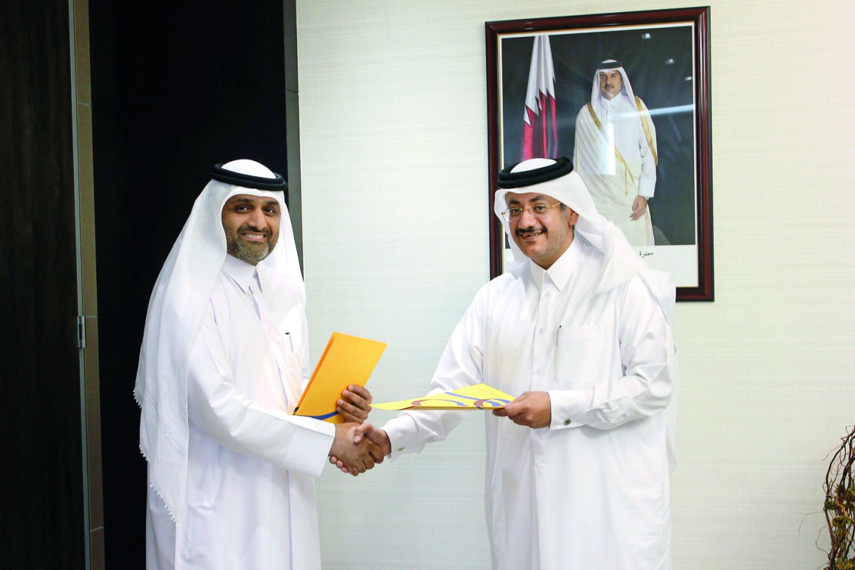 Qatar Post Chairman and Managing Director Faleh Mohammed Al Nuaimi and Nasser Saeed Al Nuaimi, Deputy Chief Quality Officer and Co-Director for Hamad Healthcare Quality Institute at HMC at the signing ceremony.