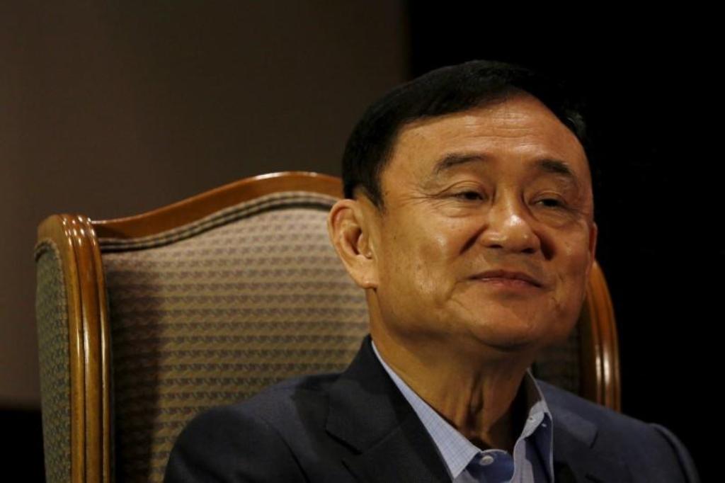 FILE PHOTO: Former Thai Prime Minister Thaksin Shinawatra looks on as he speaks to Reuters during an interview in Singapore February 23, 2016. REUTERS/Edgar Su/File Photo.