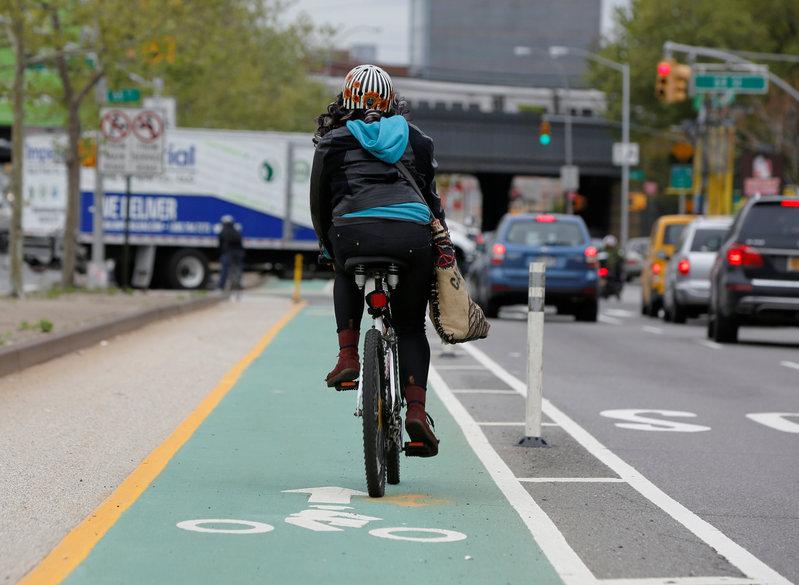 File photo of a woman riding a bicycle along a designated bike lane in New York. REUTERS/Shannon Stapleton
