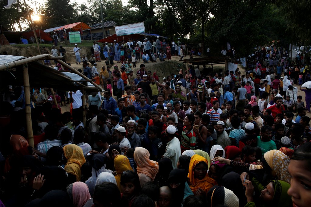 An image of Rohingya refugees line up to receive food supplies at Hakim Para refugee settlement near Cox's Bazar, Bangladesh, November 21, 2017. REUTERS/Susana Vera