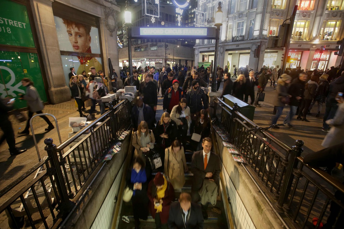 Commuters descend the stairs to catch the tube at Oxford Circus Station in central London on November 24, 2017, following an incident. Police rushed to London's Oxford Circus on Friday, sparking fears of a terror attack, but they have now stood down after