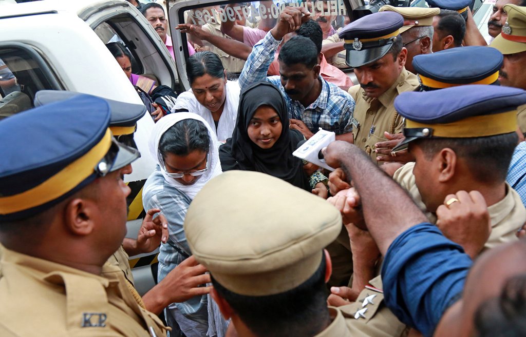 Akhila, 24, who converted to Islam in 2016 and took a new name, Hadiya, arrives at the airport in Kochi, India November 25, 2017. REUTERS/Sivaram V
