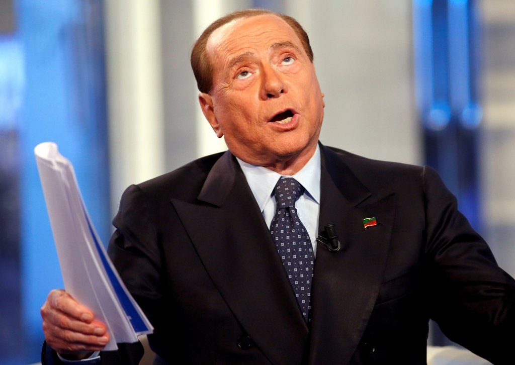 A file photo of Italy's former Prime Minister Silvio Berlusconi gestures as he attends television talk show 