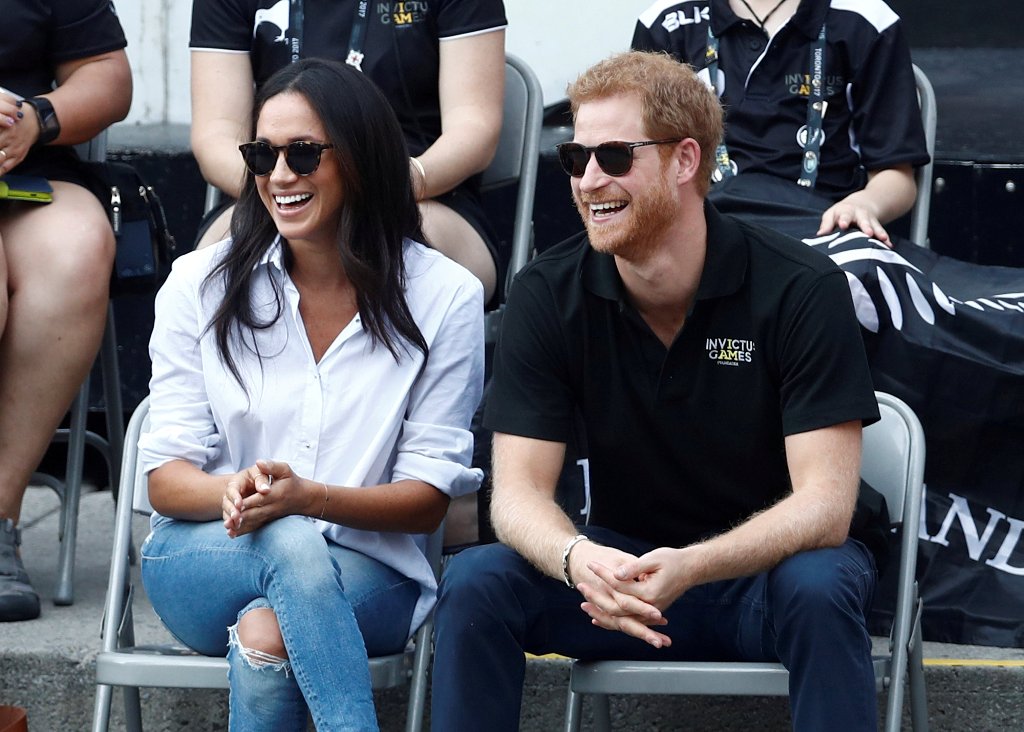 FILE PHOTO: Britain's Prince Harry and his girlfriend actress Meghan Markle watch the wheelchair tennis event during the Invictus Games in Toronto, Ontario, Canada September 25, 2017. REUTERS/Mark Blinch/File Photo
