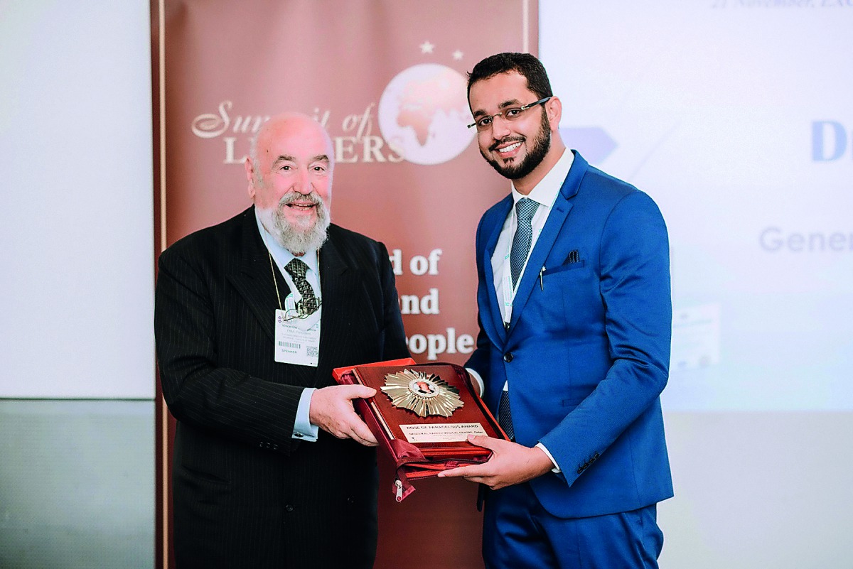 An official of Naseem Al Rabeeh Medical Centre receiving the award . 