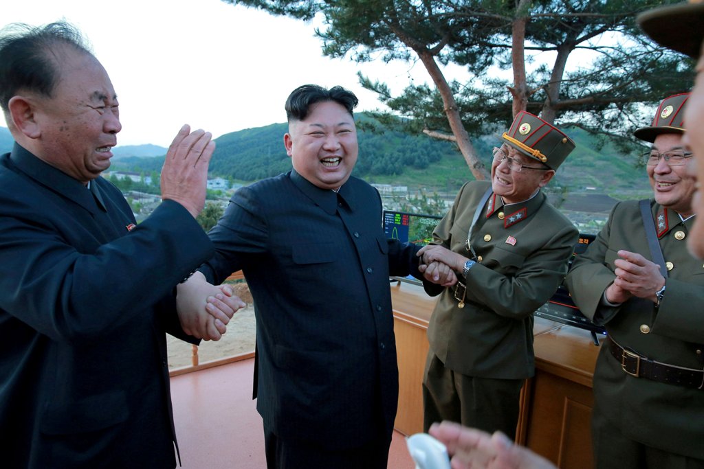 FILE PHOTO: North Korean leader Kim Jong Un reacts with Ri Pyong Chol (L) in this undated photo released by North Korea's Korean Central News Agency (KCNA) on May 15, 2017.