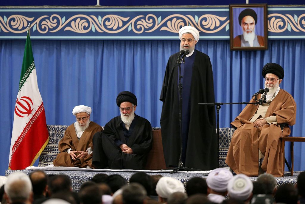 A handout photo provided by the office of Iran's supreme leader Ayatollah Ali Khamenei on December 6, 2017 shows him (R) listening to President Hassan Rouhani (2nd-R) speaking, during a meeting with the Iranian government in the capital Tehran, also atten