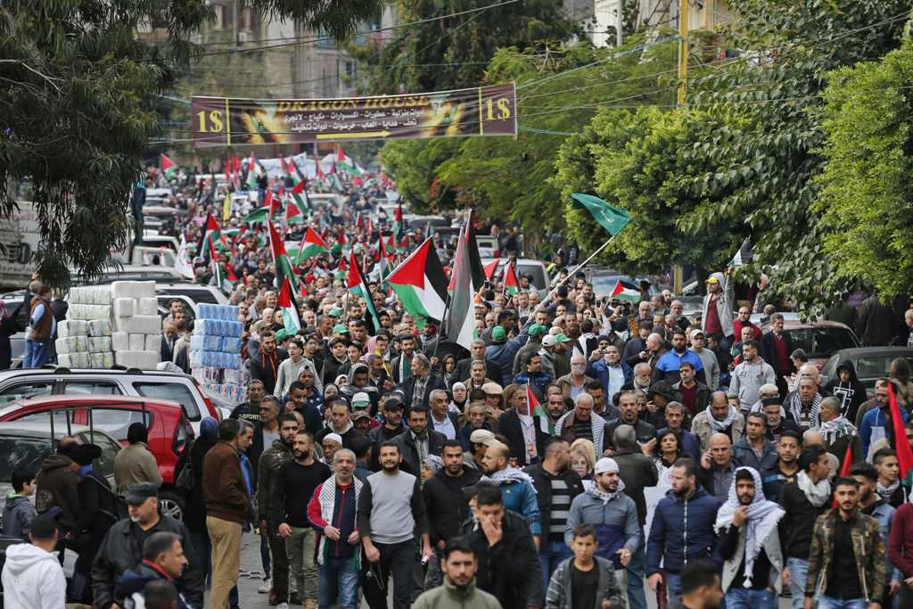 Palestinian and Lebanese protesters take to the streets in the Lebanese capital Beirut on December 8, 2017 to denounce the widely criticised decision by US President Trump to recognise Jerusalem as the capital of Israel. / AFP / ANWAR AMRO.