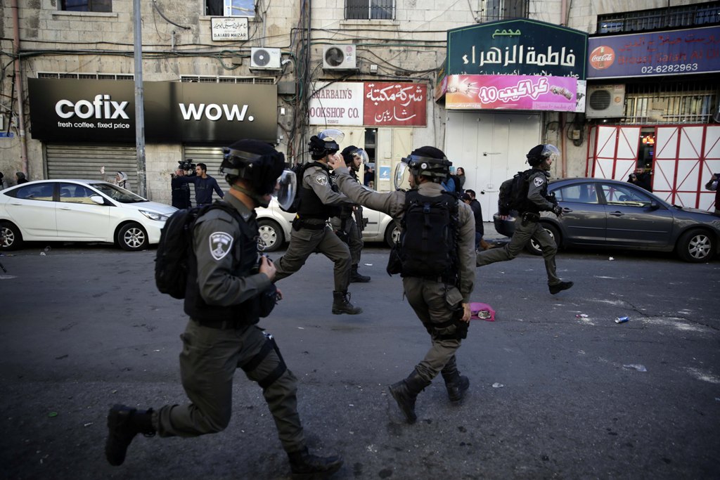 Israeli security forces intervene demonstrators during a protest against U.S. President Donald Trump’s announcement to recognize Jerusalem as the capital of Israel and plans to relocate the U.S. Embassy from Tel Aviv to Jerusalem, on December 9, 2017 in E