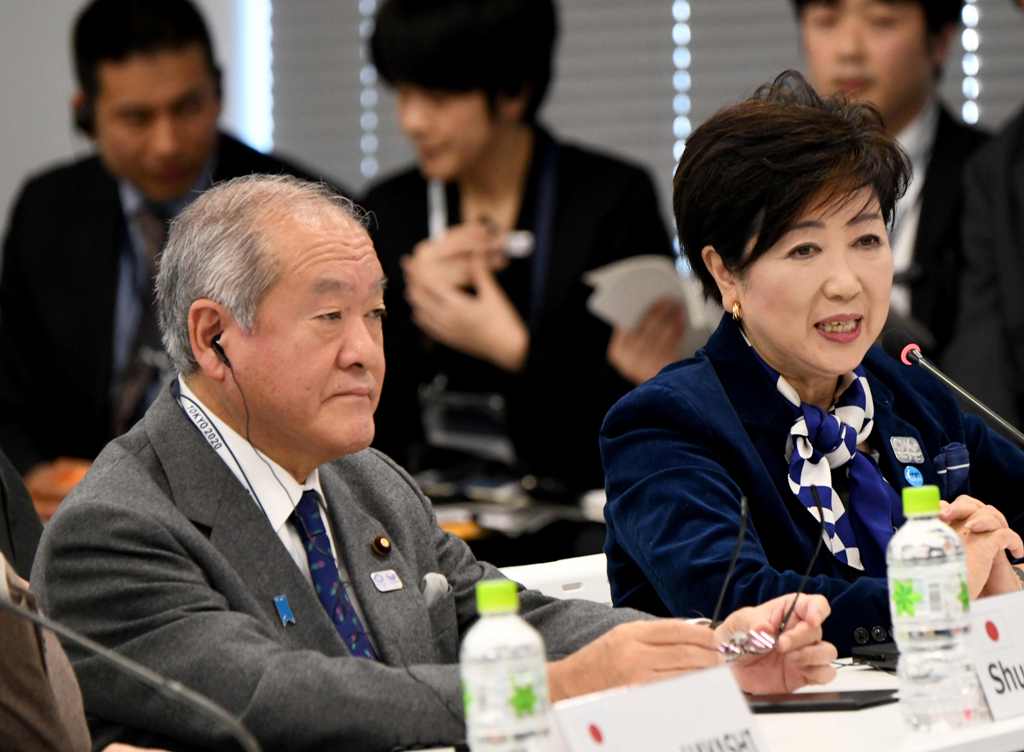 Tokyo Governor Yuriko Koike (R) delivers a speech beside State Minister in charge of Tokyo Olympics Shunichi Suzuki (L) during the fifth meeting of the International Olympic Committee (IOC) Coordination Commission for the Olympic Games Tokyo 2020 in Tokyo