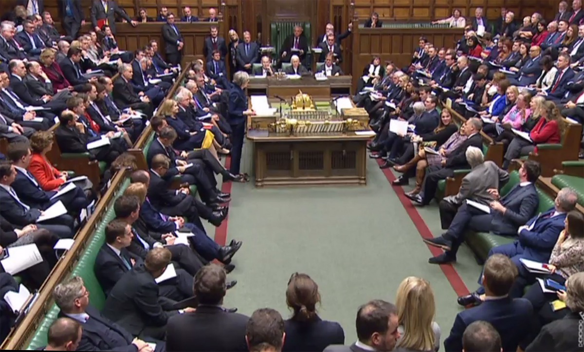 A video grab from footage broadcast by the UK Parliament's Parliamentary Recording Unit (PRU) shows British Prime Minister Theresa May making a statement to lawmakers regarding the Brexit phase one negotiations interim deal in the House of Commons in Lond