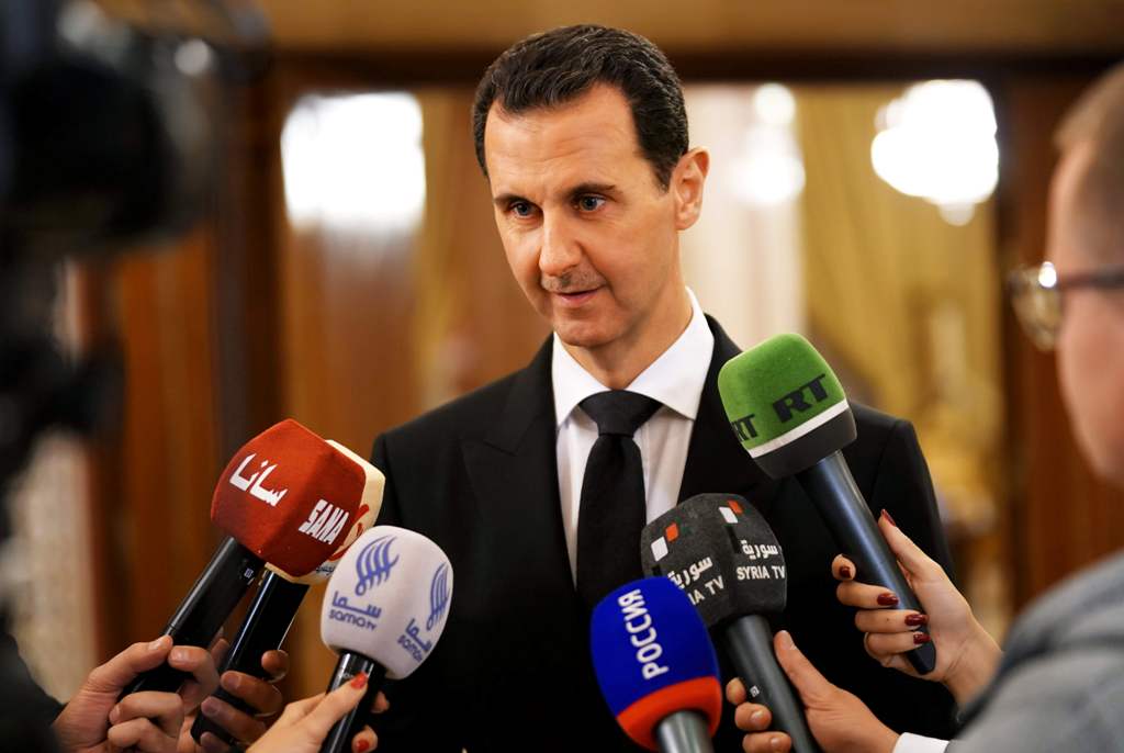Syrian President Bashar al-Assad speaking to the press after receiving a Russian delegation in Damascus. / AFP / SANA 
