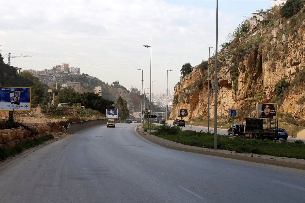 Cars pass near the area where British embassy worker Rebecca Dykes' body is believed to have been found by a main road outside Beirut, Lebanon December 18, 2017. REUTERS/Mohamed Azakir