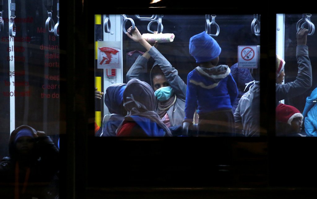 Evacuated migrants taken out of detention centres by the UNHCR from Tripoli in Libya arrive at the military airport Pratica di Mare in Rome, Italy, December 22, 2017. REUTERS/Alessandro Bianchi