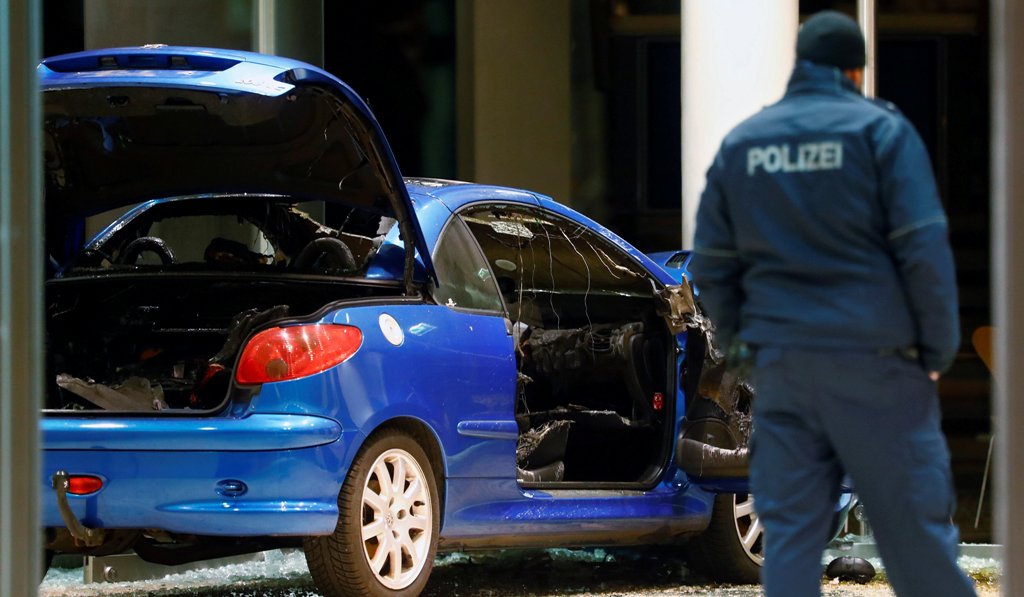 A damaged car is pictured inside the party headquarters of the Social Democratic Party of Germany (SPD) after it crashed into the building in Berlin, Germany, December 25, 2017. REUTERS/Hannibal Hanschke