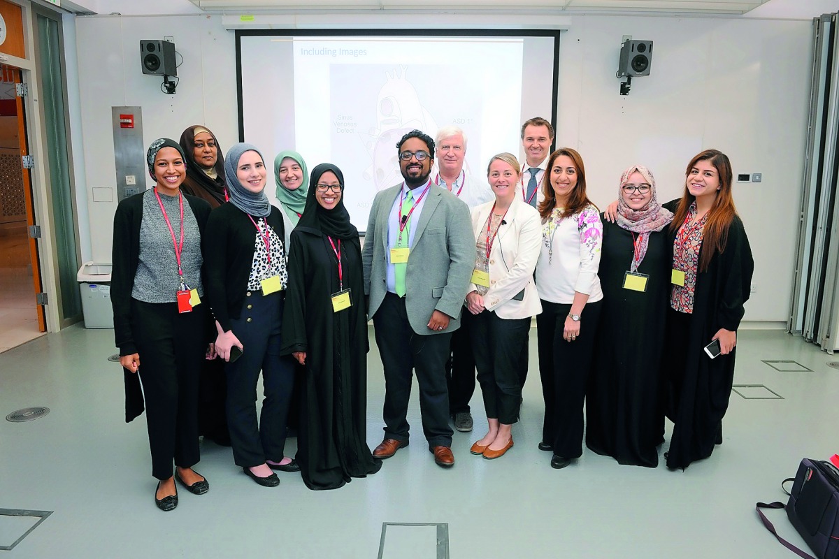 Speakers with some participants during the symposium. 