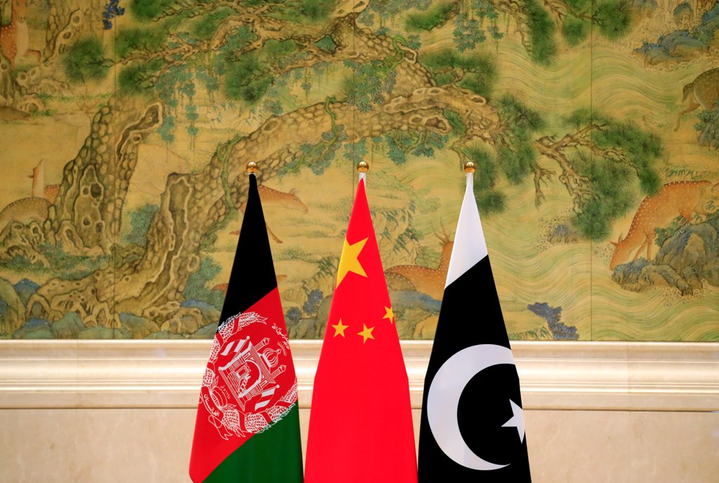 (L-R) Afghan, Chinese and Pakistani flags are placed at the lobby during the 1st China-Afghanistan-Pakistan Foreign Ministers' Dialogue in Beijing, China, December 26, 2017. REUTERS/Jason Lee