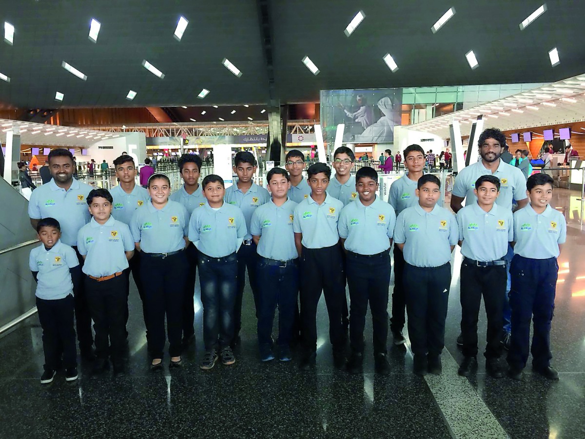 Stallions Cricket Academy players and officials pose for a photograph prior to their departure for Oman at the Hamad International Airport in Doha on Saturday.
