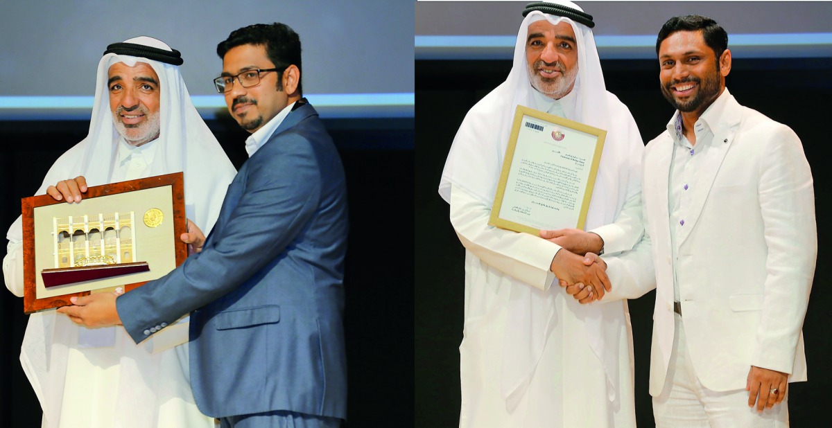 Salah Al Mulla presenting the awards to Firose S A (left) and Saleel Ibrahim.