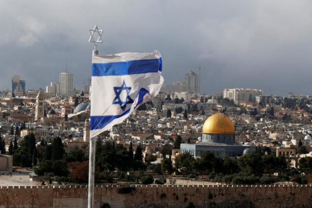 An Israeli flag is seen near the Dome of the Rock, located in Jerusalem's Old City on the compound known to Muslims as Noble Sanctuary and to Jews as Temple Mount December 6, 2017. REUTERS/Ammar Awad/File Photo