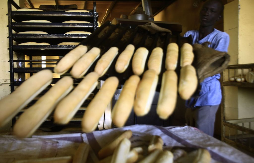 A Sudanese man works at a bakery in the capital Khartoum on January 5, 2018.  AFP / ASHRAF SHAZLY
