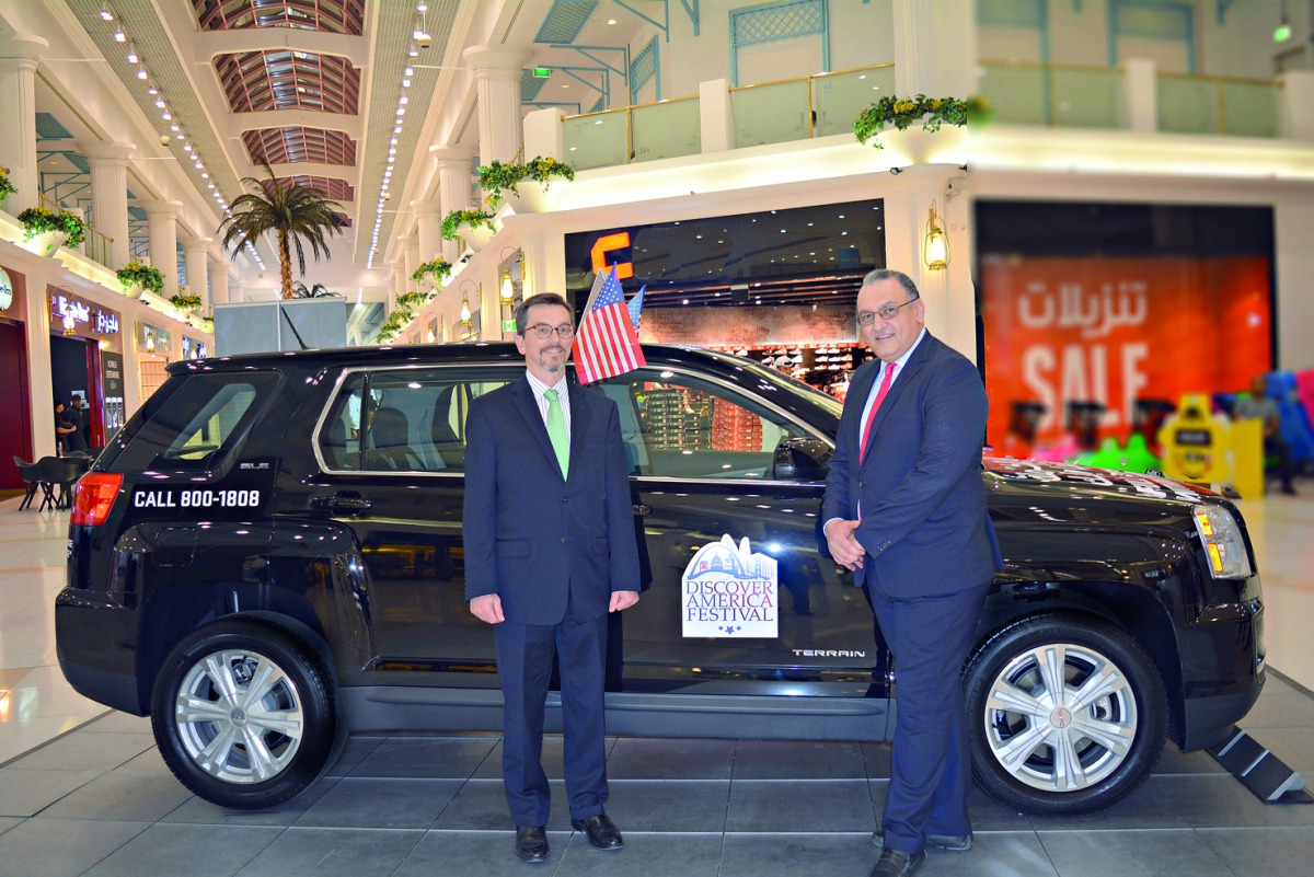 Former Chargé d’Affaires for the US Embassy in Doha, William Grant, and Mahmoud Skhiri, General Sales Manager of Mannai Automotive, during the Discover America Festival featuring the GMC Terrain at the Landmark.