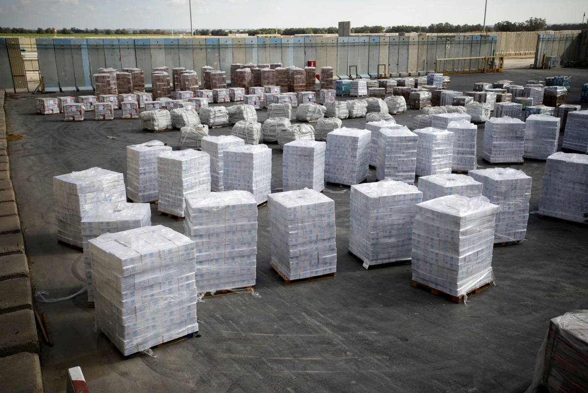 Boxes containing aid from the U.N. Relief and Works Agency (UNRWA) are seen ahead of their transfer to the Gaza Strip, inside the Kerem Shalom border crossing terminal between Israel and Gaza Strip January 16, 2018. Reuters/Amir Cohen