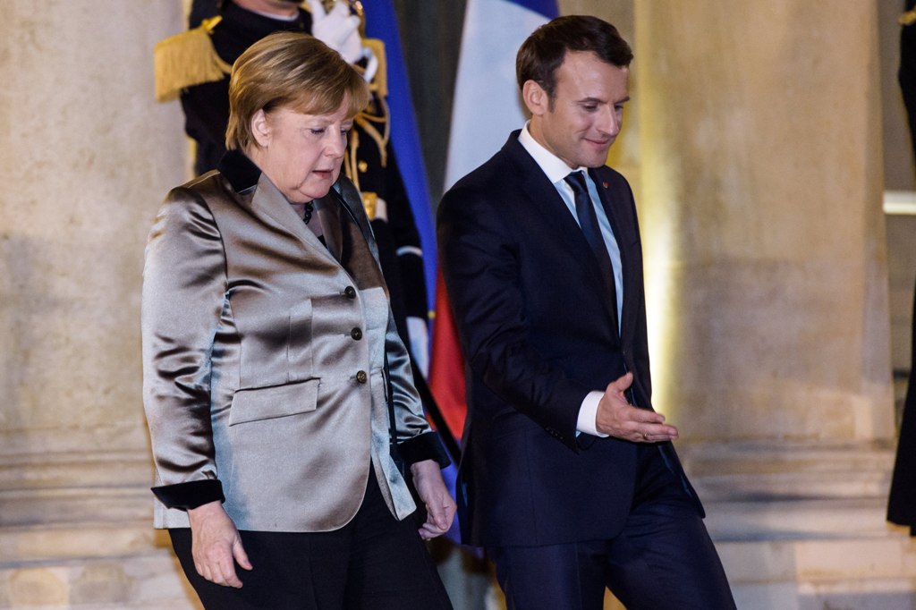 French President Emmanuel Macron (R) and German Chancellor Angela Merkel (L) leave the Elysee palace after their meeting in Paris, France, 19 January 2018. Merkel is in Paris for a one-day work visit. EPA/CHRISTOPHE PETIT TESSON