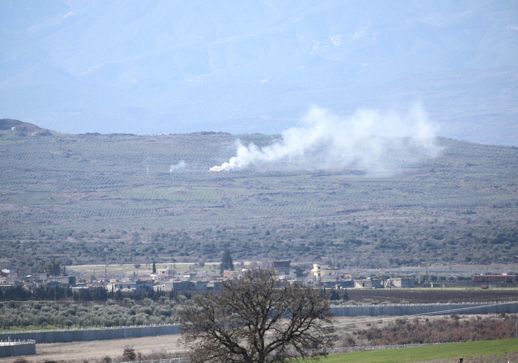 The photo taken from Turkey's Kilis province shows smoke rising as Turkish army hit PYD/PKK terror group's shelters 