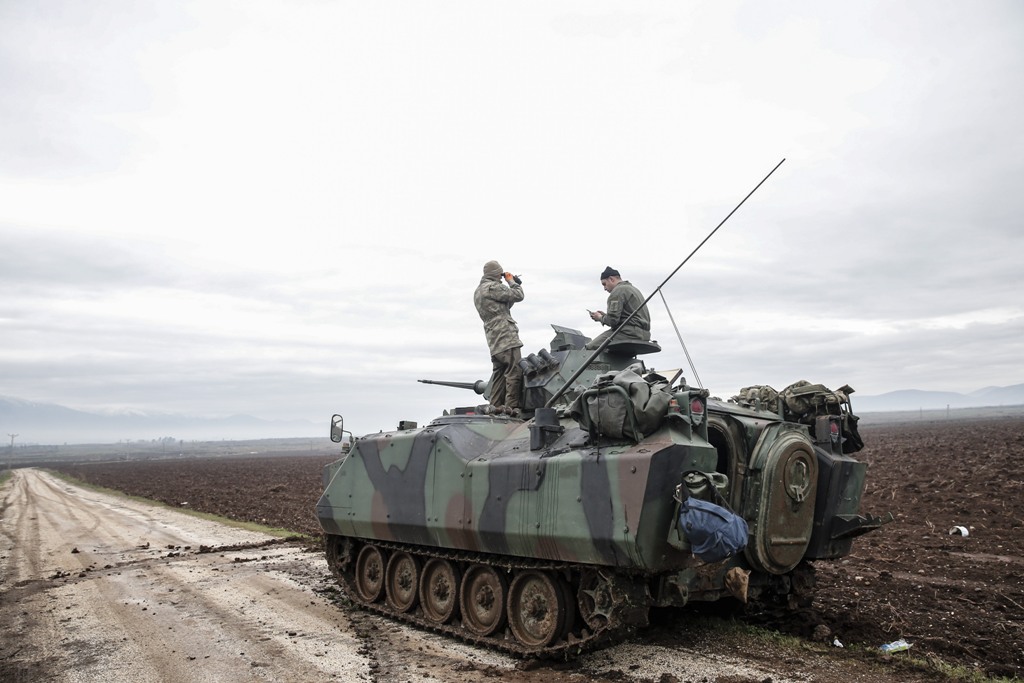 Turkish military tanks are prepared for deployment as part of the 