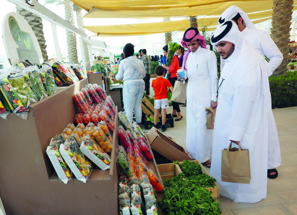Visitors checking out vegetables on offer at the market.