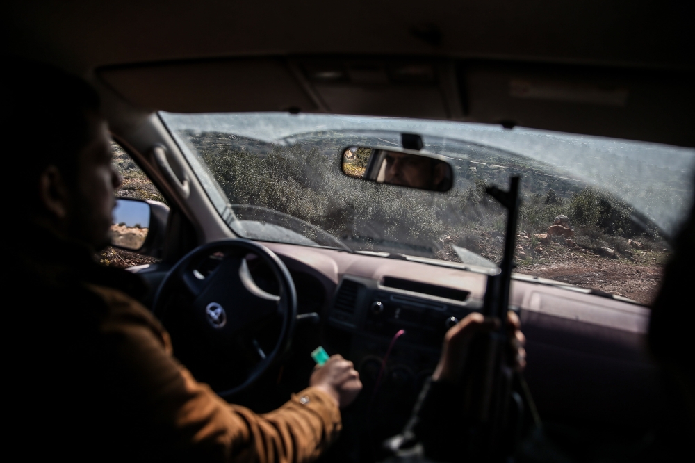 Free Syrian Army (FSA) members backed by Turkish Army are seen as they hit PYD/PKK targets in western Afrin, as part of the ongoing military operation in northwestern Syria on January 28, 2018. Onur Çoban - Anadolu 