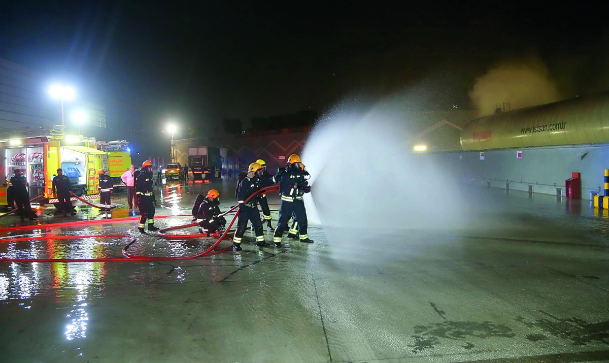 The members of fire fighting team in action. 