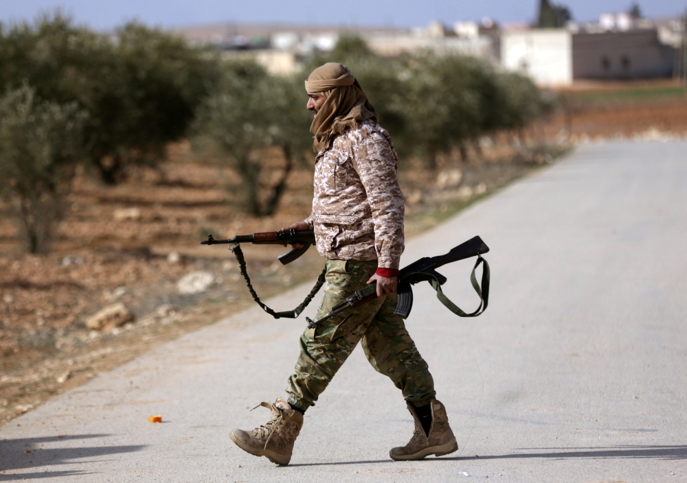 Turkey-backed Free Syrian Army fighter is seen at al Ajami village in east al Bab, Syria February 3,2018.REUTERS/ Khalil Ashawi