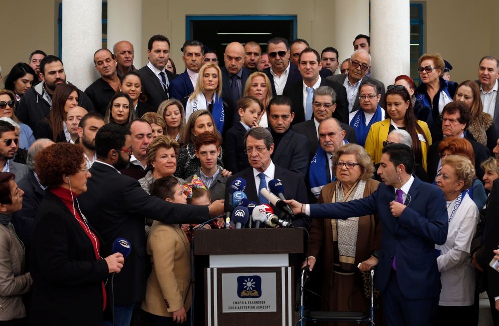 Cypriot President Nicos Anastasiades (C) delivers a speech after casting his ballot at a polling station in the coastal city of Limassol on February 4, 2018 during the second round of the Cyprus presidential elections. AFP / Amir Makar  